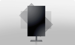 Two Samsung monitors are placed side by side. The monitor on the left is pivoted, displaying a grid of small photos including interior spaces and plants, while the monitor on the right shows a high-resolution cave scene with water and stones.